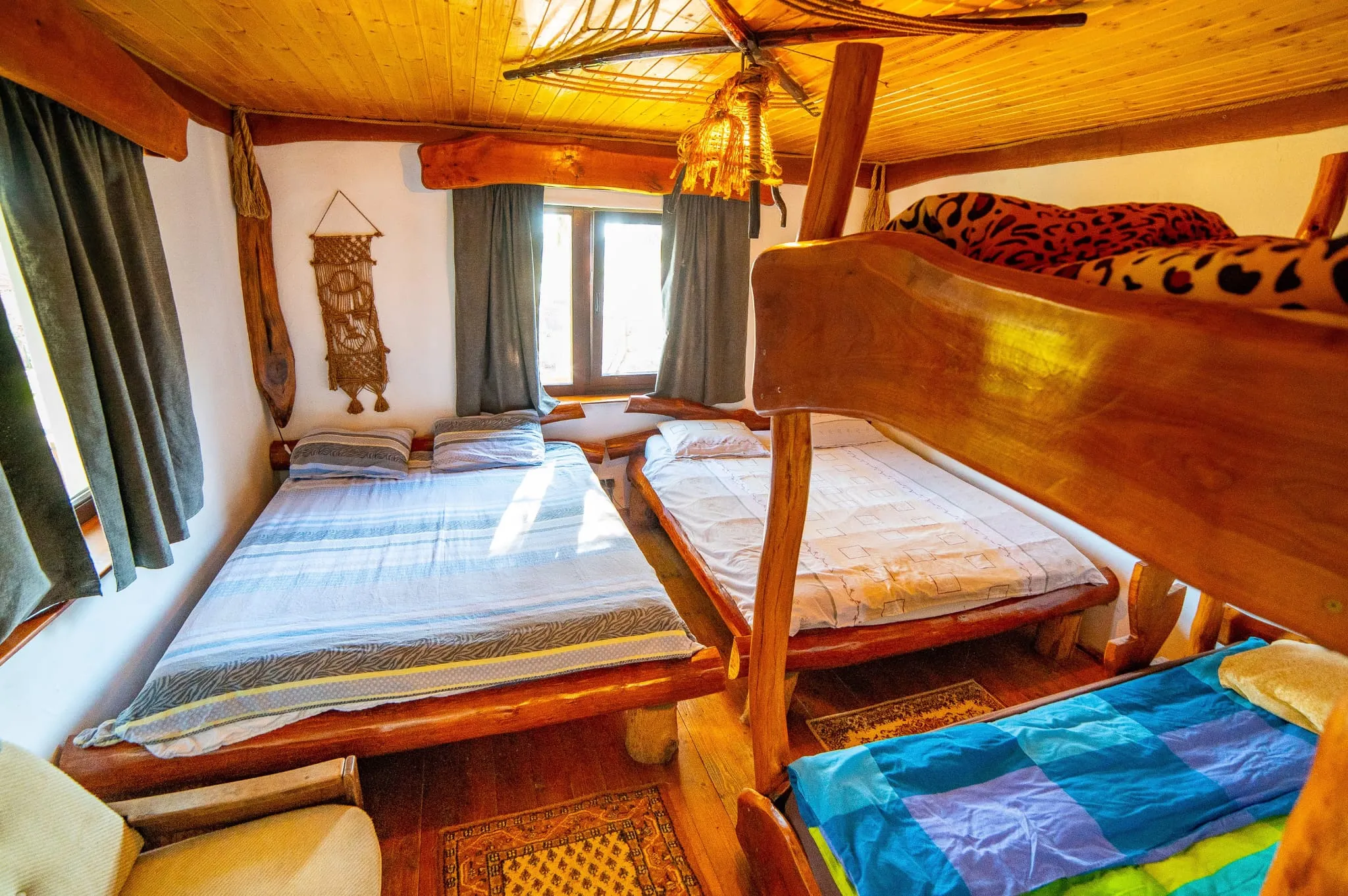 Rustic bedroom with a bunk bed and wooden furniture